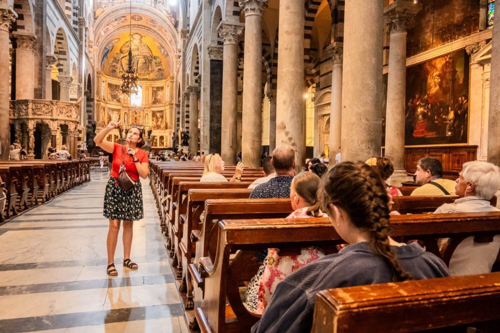 Interior of Pisa Cathedral with marble columns and golden ceiling