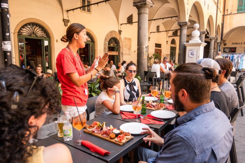 Eating in Pisa during a Pisa vs Florence day trip, with local Tuscan food served in a traditional restaurant
